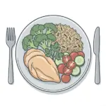 receta saludable equilibrada con pollo, arroz integral, verduras y tomate